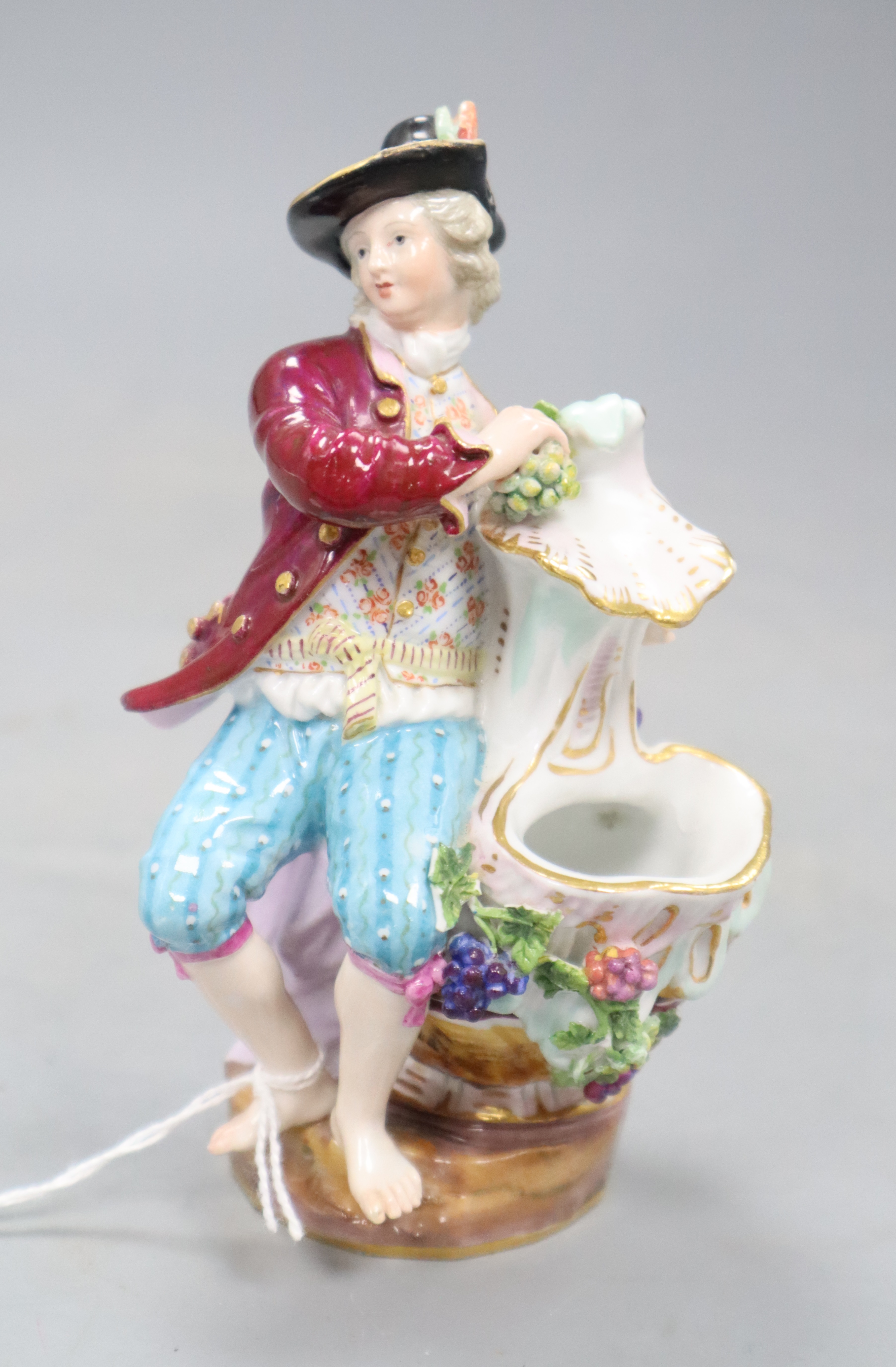 A late Meissen figural salt, modelled as a seated gallant and companion beside a floral encrusted shell